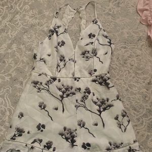 White romper with gray flowers